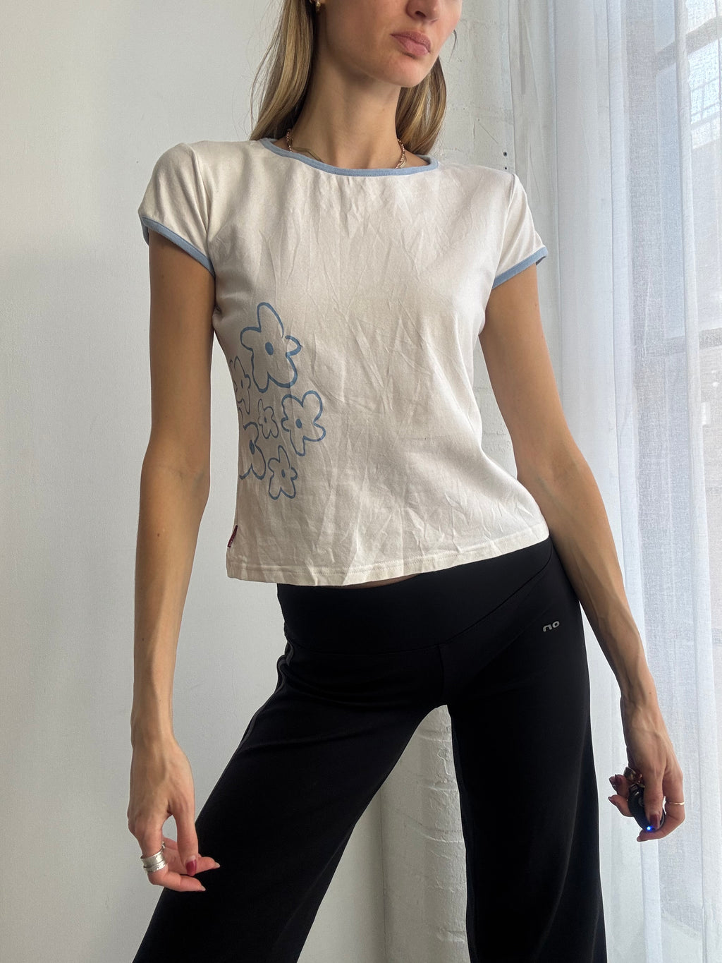 Vintage Y2K white baby tee with blue flower detail